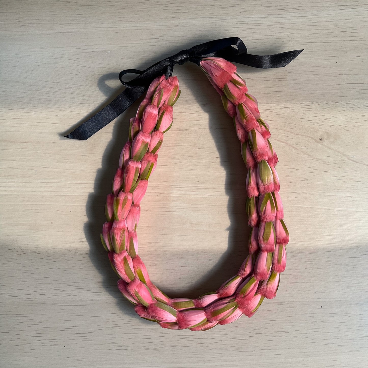 Triple strand lokelani lei hulu (feather lei)