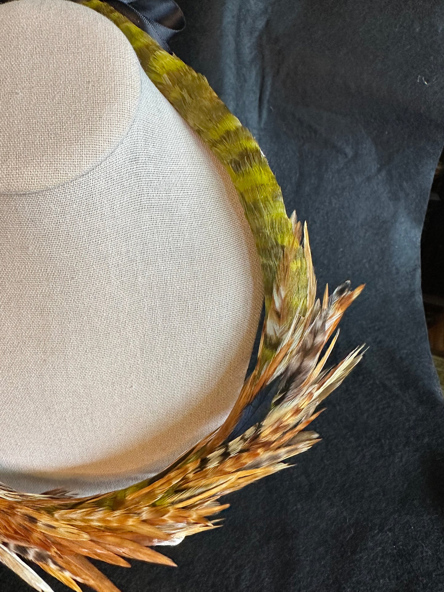 Asymmetric Olive Green and Red Chinchilla lei kamoe (feather lei)