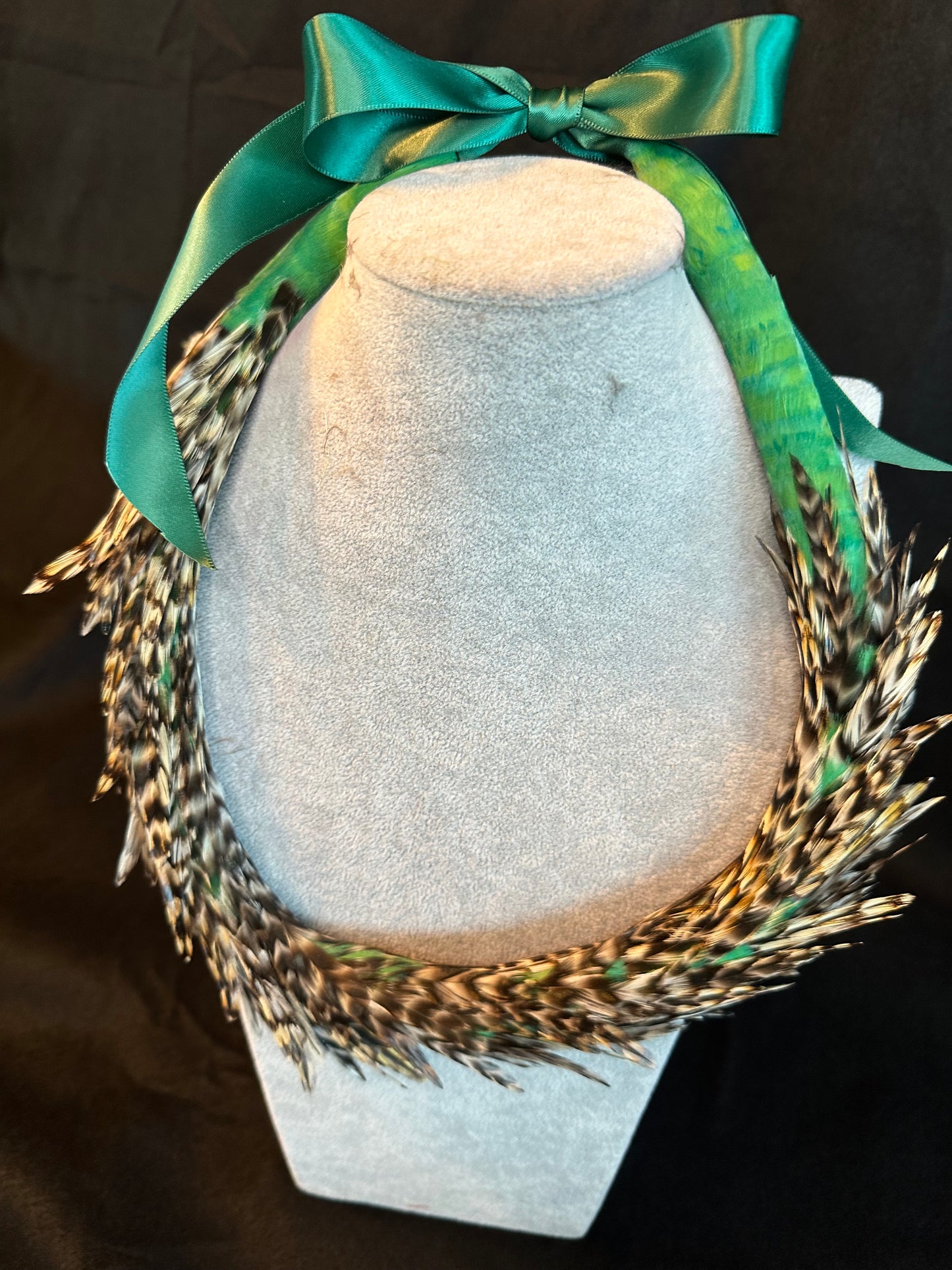 Asymmetric crocodile green with chinchilla rooster lei hulu (feather lei)