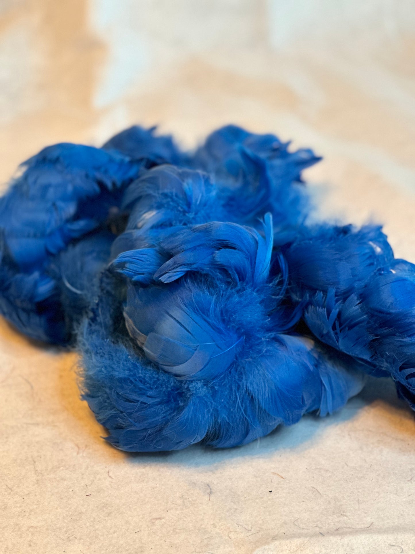 Custom-dyed Blues & Purple Goose Coquille feathers