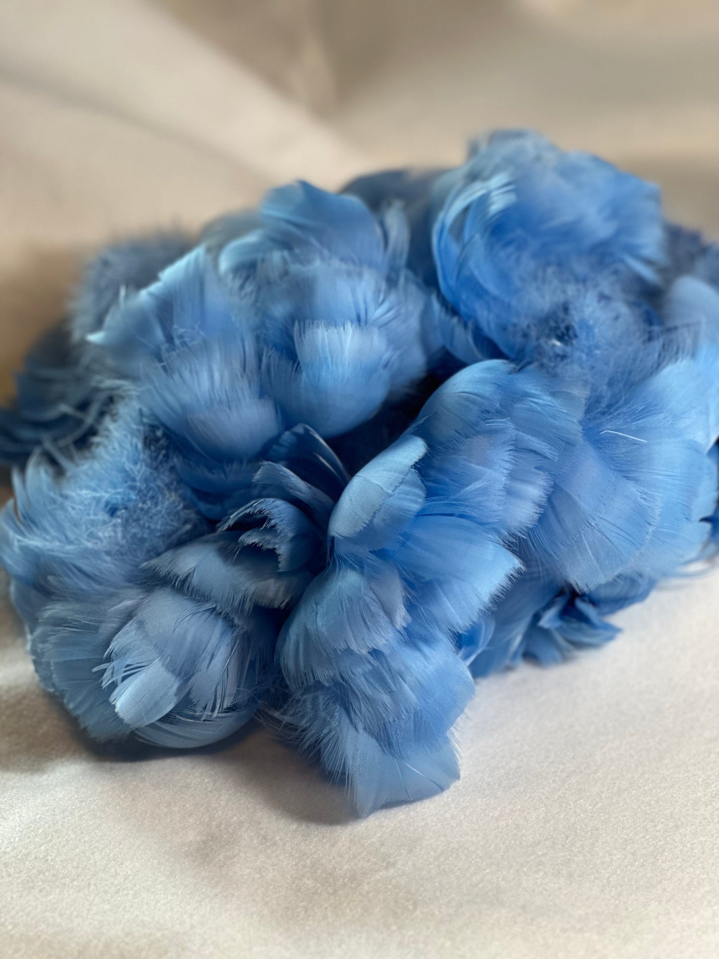 Custom-dyed Blues & Purple Goose Coquille feathers