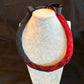 Red and Black Ekolu (2nd cut) Kamoe (lying flat) Lei Hulu (feather lei)