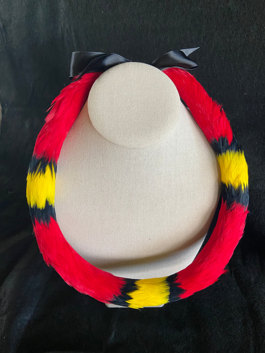 Traditional kamoe style lei hulu (feather lei)